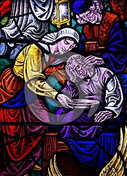 Feeding the poor in stained glass