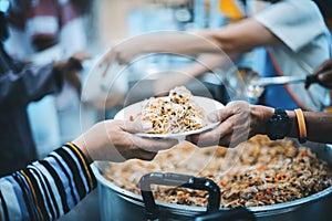 Feeding the poor to hands of a beggar. Poverty concept