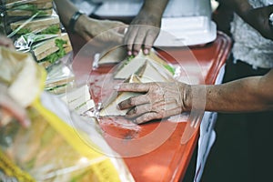 Feeding to hand the poor helping  beggar in social, Poverty concept