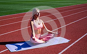 feel harmony. yoga and pilates. sport healthy lifestyle. fitness coach. sexy woman stretching outdoor. athletic woman in
