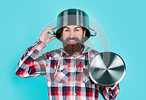 Feel protected. bearded man hold kitchen pan. brutal hipster cooking with saucepan. housekeep husband cook in pot