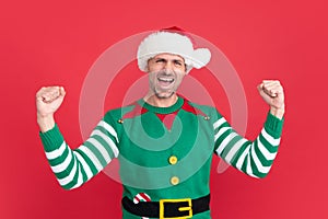 feel the success. happy shouting man in elf costume. xmas guy in santa claus hat