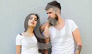 Feel their style. Couple white shirts cuddle each other. Hipster bearded and stylish girl hang out urban romantic date