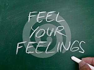 Feel your feeling, word text written on chalkboard, motivational inspirational life quotes