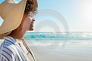 Feeling the gorgeous ocean air on my face. a young woman enjoying a day at the beach.