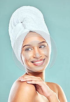 Feeling great looking better. a beautiful young woman posing against a studio background.