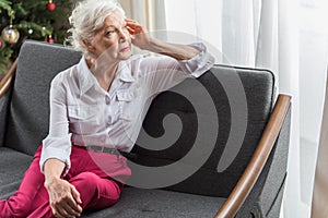 Serious old woman is expressing hopeless photo