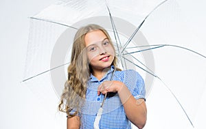 Feeling protected at this autumn day. Autumn fashion. Child. Smiling little girl with umbrella. Happy childhood. School