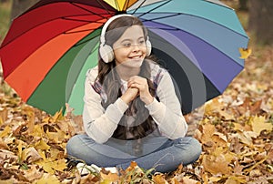 Feeling protected. autumn kid under colorful umbrella. feel the inspiration. happy childhood. back to school. girl in