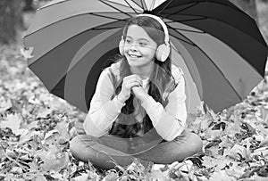 Feeling protected. autumn kid under colorful umbrella. feel the inspiration. happy childhood. back to school. girl in