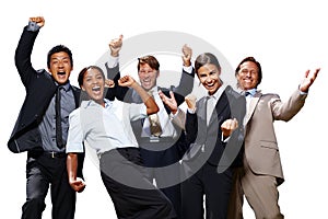 That feeling of success. Shot of a group of business people acting excited with their hands in the air on a white