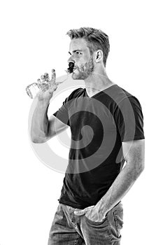 Feeling thirsty. Man athlete hold water bottle. Guy drink water on white background. Man care health and water balance