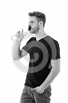 Feeling thirsty. Man athlete hold water bottle. Guy drink water on white background. Man care health and water balance