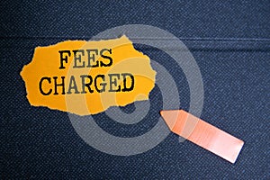 FEES CHARGED text on sticky on chart, business