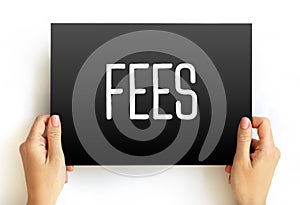 FEES - the price one pays as remuneration for rights or services, text concept on card