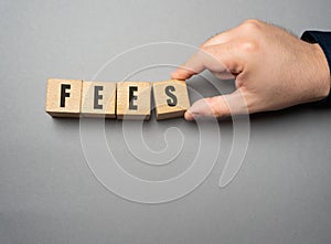 Fees word concept. Fixed price charged for a specific service.