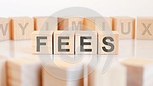 fees word made with building blocks, concept.