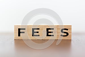 Fees word written on wooden cubes