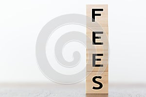 Fees word written on wooden cubes