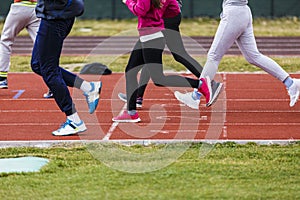 feet of athletes on a track