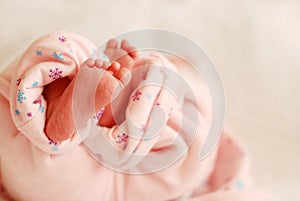 Feet of baby girl newborn