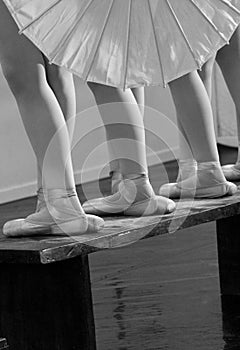 Feet of ballet dancers in fifth positions