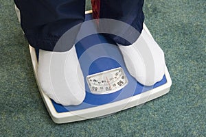 Feet on bathroom scale