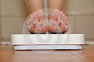 Feet on bathroom scale