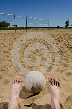 Feet and beach volleyball