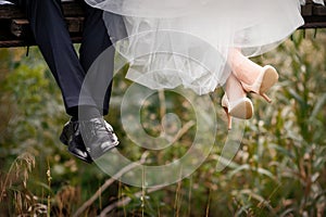 Feet of bride and groom, wedding shoes