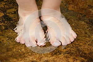 Feet in a brook photo