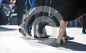 Feet of business people walking in the City of London. Busy modern life concept.