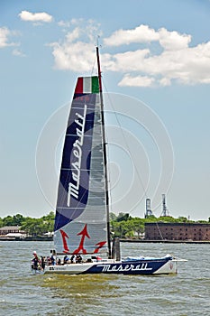 Racing yacht VOR70 Maserati sail sailing cruise cruising through Hudson River in New York City