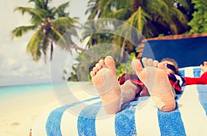 Feet of child relaxed and enjoying summer beach