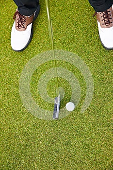 Feet, club and golf sports on field, training and practice for competition or tournament. Closeup, shoes and grass for