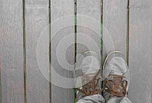 Feet concept with old brown shoes with space for text or symbol