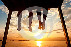 Feet of couple on the beach