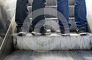 Feet on the escalators