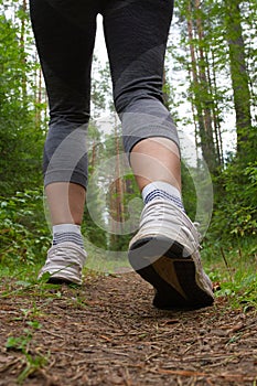 Feet on a forest trail