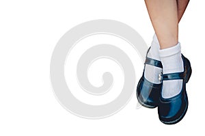Feet of girl wear a black student shoes with  isolated on white background with clipping path