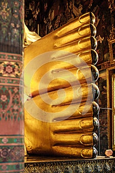 Feet of the golden reclining Buddha statue at the Wat Pho Temple, Bangkok, Thailand