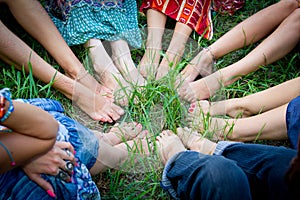 Feet of group of young girls in a circle