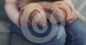 .Feet, hands and baby with mother for care, love and family bonding in their home together. Newborn, toes and mom with