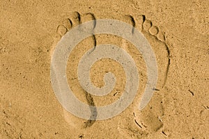 Feet imprint in sand