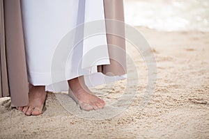 Feet of Jesus on sand