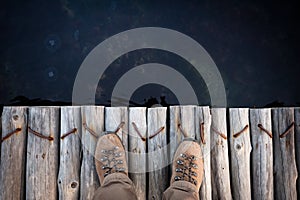 Feet of man in hiking boots