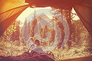 Feet Man relaxing enjoying clouds mountains aerial view from tent camping