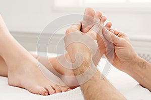 Feet massage closeup, acupressure