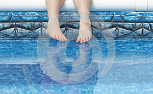Feet in pool water