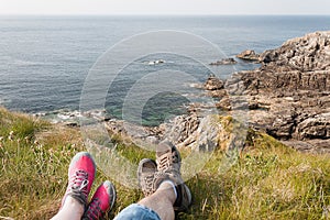 Feet Resting after a Hike, Rocky Coast, Mallin Head, Ireland photo